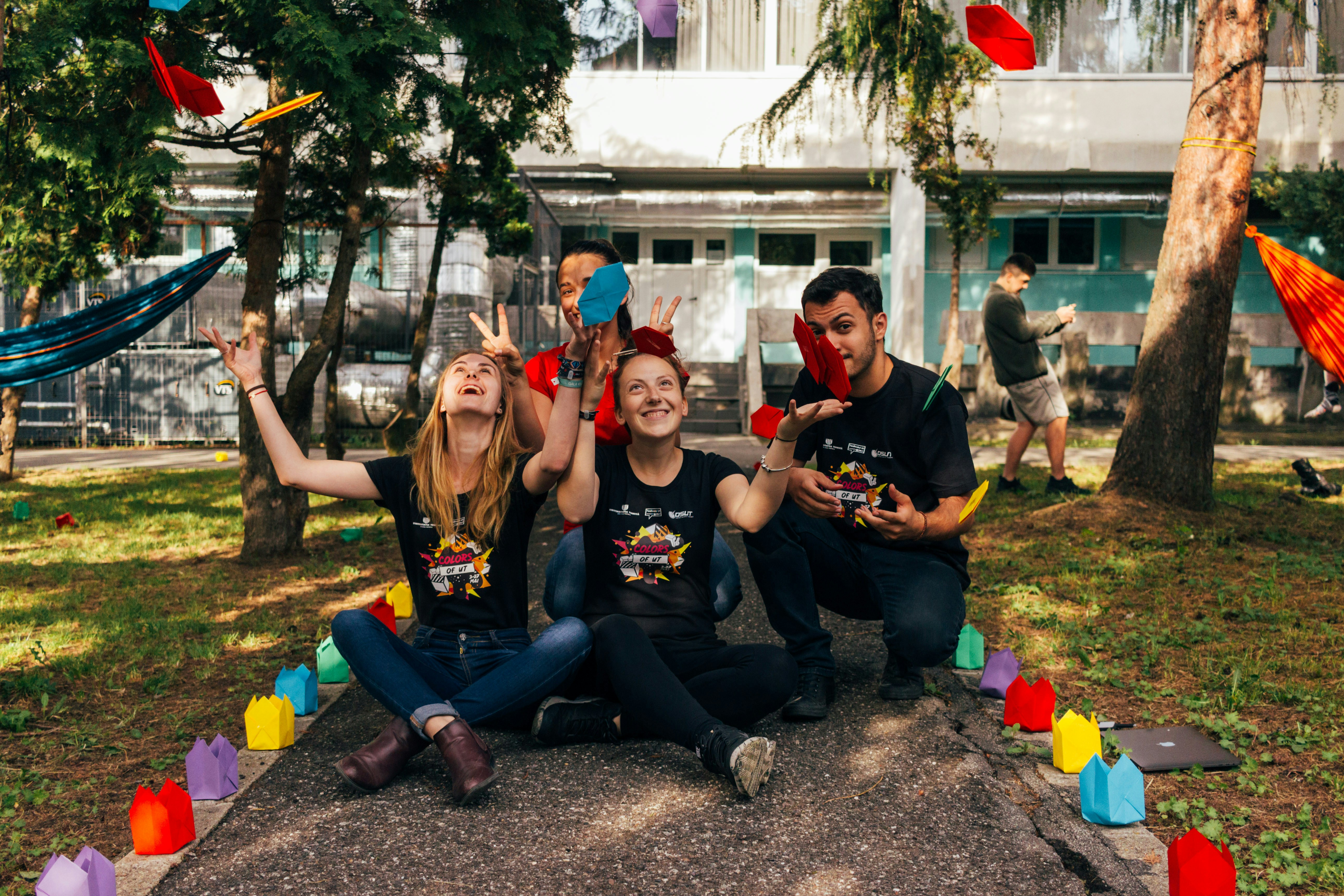 Group of volunteers sitting outside in a park 